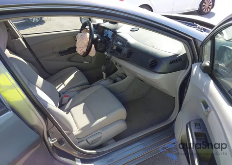 2011 Honda Insight from USA, damaged, VIN JHMZE2H3XBS005408